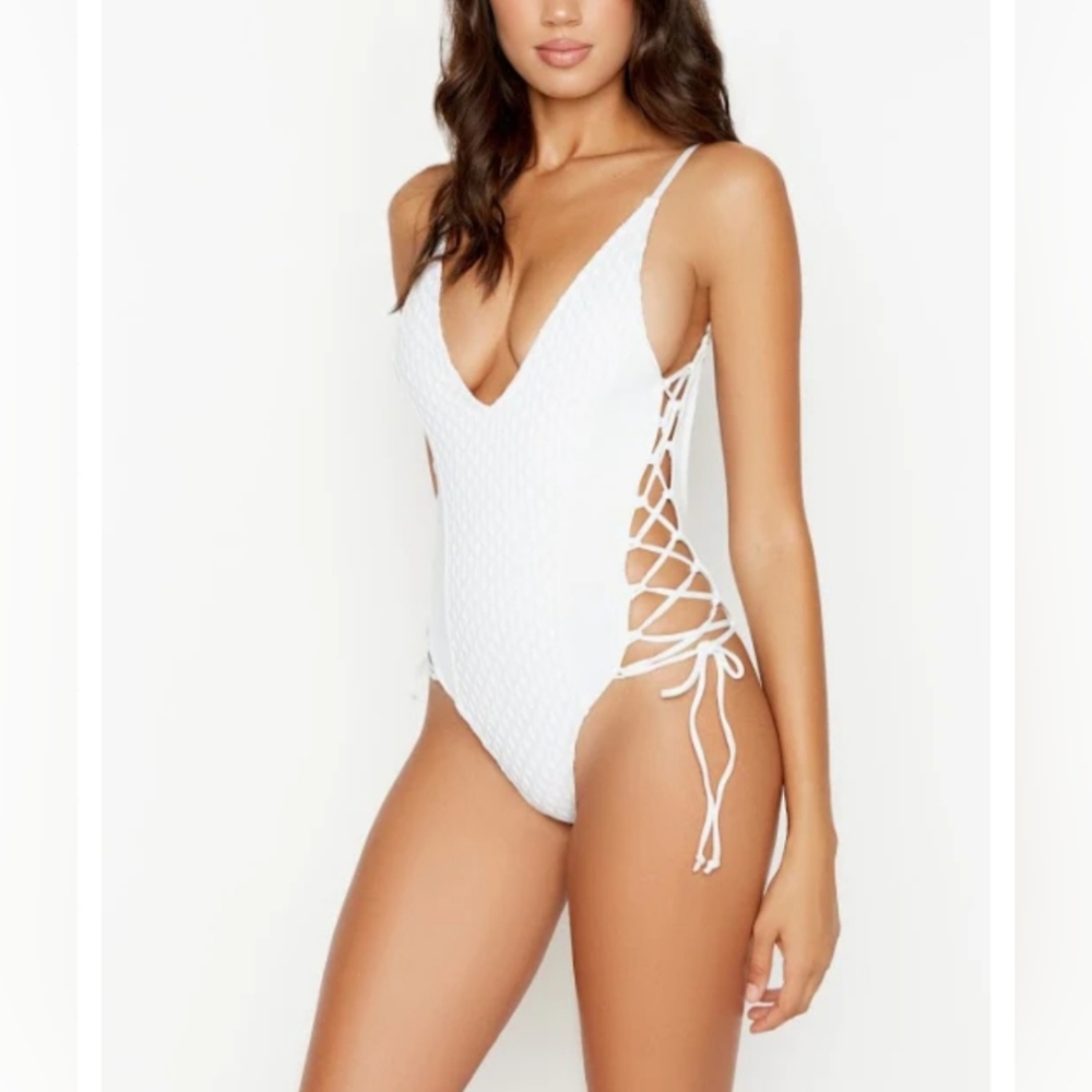 RISK Swim suit white one piece in size small NWOT still has hygiene sticker.